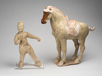 A Chinese Straw Glazed Earthenware Figure of a Groom and Horse, Tang Dynasty (618-907 CE) by  Chinese Art