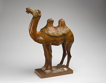 A Large Chinese Sancai Glazed Earthenware Model of a Camel, Tang Dynasty (618-907 CE) by  Chinese Art