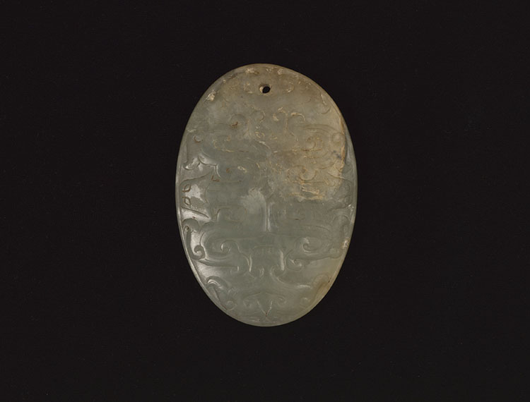 A Chinese Pale Celadon Jade Oval ‘Dragon’ Pendant by  Chinese Art